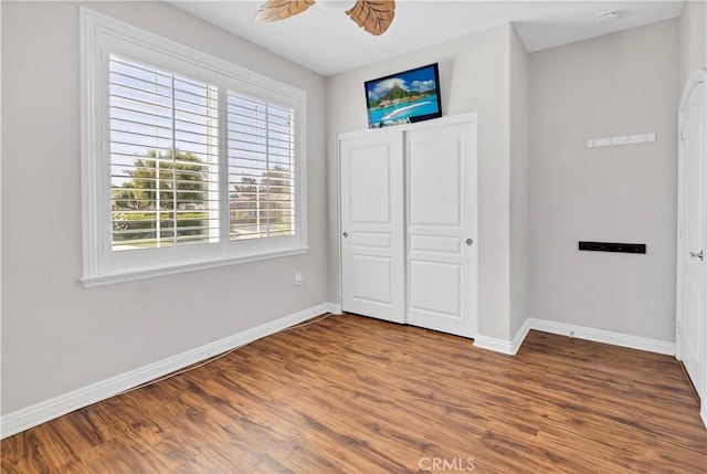 243 Firestone, Hemet, CA 92545 - unfurnished bedroom with baseboards, wood finished floors, a closet, and ceiling fan