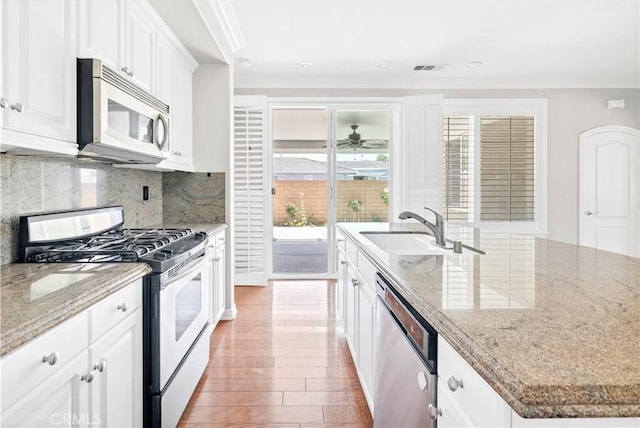 243 Firestone, Hemet, CA 92545 - kitchen with appliances with stainless steel finishes, a sink, crown molding, white cabinets, and wood finished floors