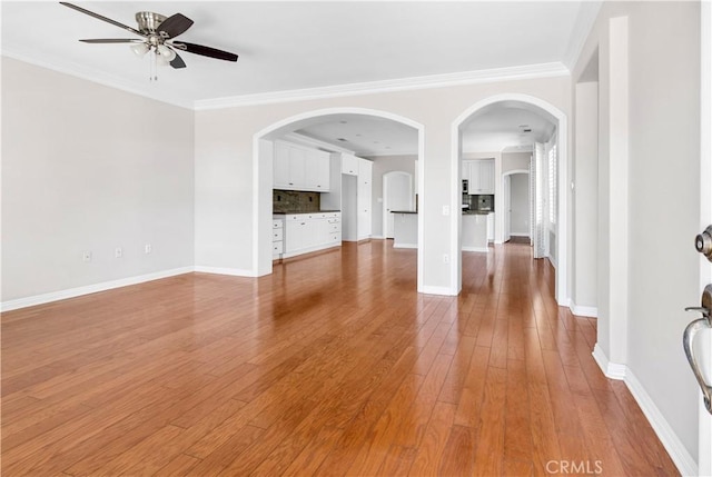 243 Firestone, Hemet, CA 92545 - unfurnished living room with ceiling fan, baseboards, crown molding, and wood finished floors