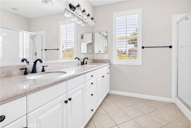 243 Firestone, Hemet, CA 92545 - full bathroom with double vanity, a shower stall, plenty of natural light, and baseboards