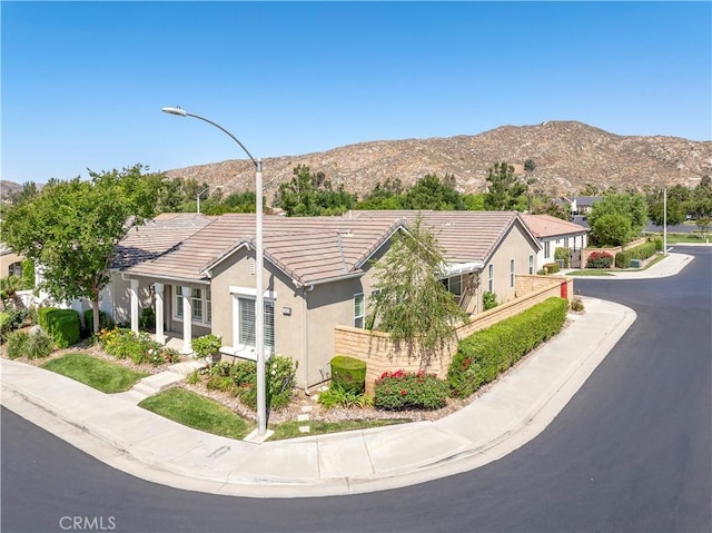 243 Firestone, Hemet, CA 92545 - single story home with a tile roof, stucco siding, and a mountain view