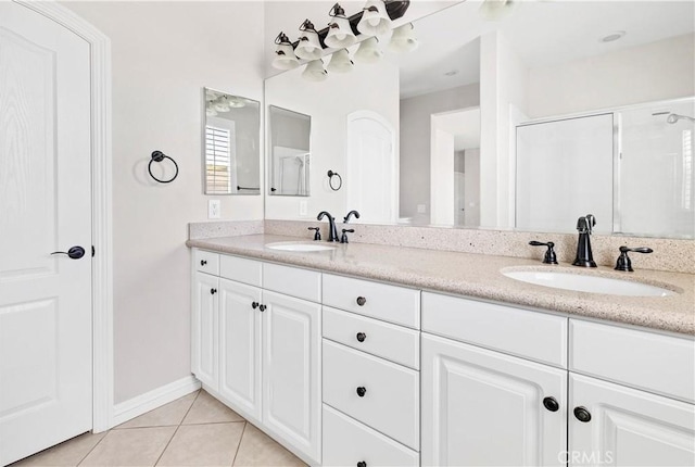 243 Firestone, Hemet, CA 92545 - bathroom featuring double vanity, tile patterned flooring, an enclosed shower, and baseboards