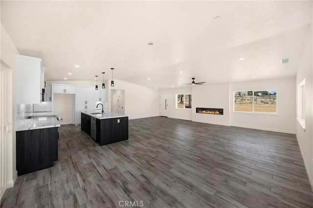 9641 Buena Vista St, Apple Valley, CA 92308 - unfurnished living room featuring wood finished floors, ceiling fan, a glass covered fireplace, a sink, and recessed lighting