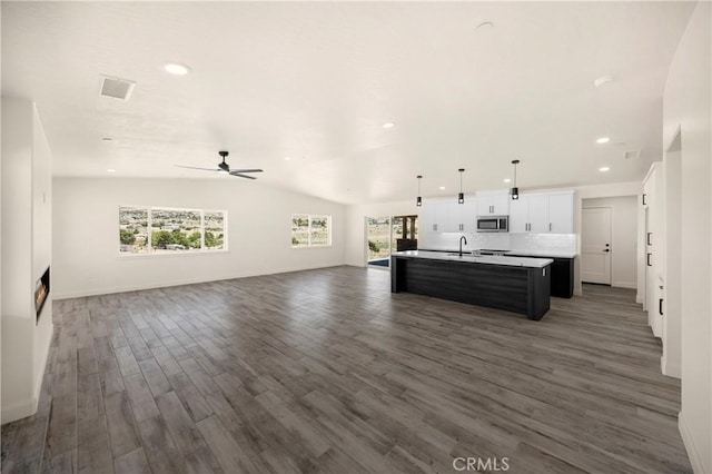9641 Buena Vista St, Apple Valley, CA 92308 - living area featuring dark wood-style floors, ceiling fan, lofted ceiling, recessed lighting, and baseboards