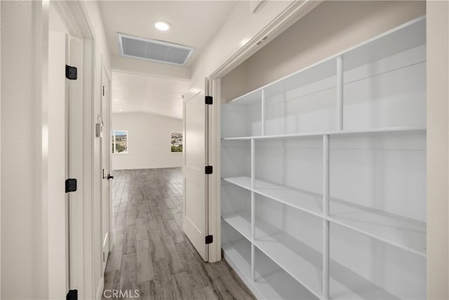 9641 Buena Vista St, Apple Valley, CA 92308 - hallway with recessed lighting, wood finished floors, and lofted ceiling