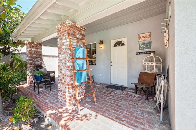 3152 Parkside Dr, San Bernardino, CA 92404 - view of exterior entry with covered porch and stucco siding
