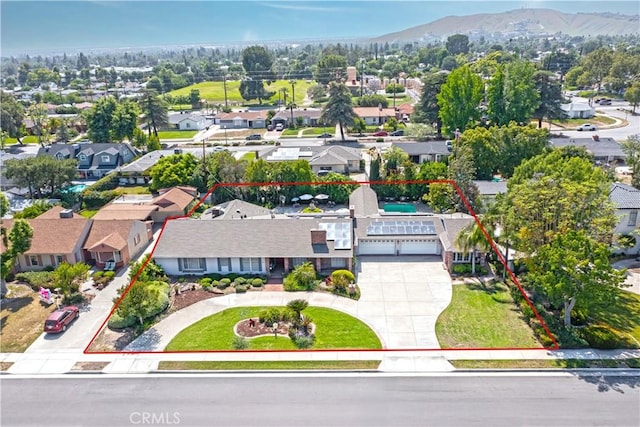 3152 Parkside Dr, San Bernardino, CA 92404 - aerial perspective of suburban area with property parcel outlined and a mountainous background