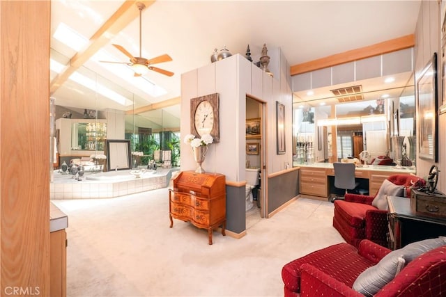 3152 Parkside Dr, San Bernardino, CA 92404 - carpeted living area with an office area, a ceiling fan, a skylight, and lofted ceiling