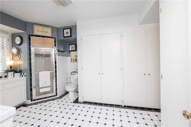 3152 Parkside Dr, San Bernardino, CA 92404 - full bathroom with toilet, a shower stall, and tile patterned floors