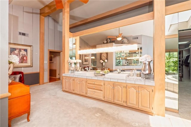 3152 Parkside Dr, San Bernardino, CA 92404 - kitchen with tile countertops, a sink, and a ceiling fan