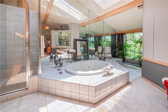 3152 Parkside Dr, San Bernardino, CA 92404 - bathroom featuring a whirlpool tub, a skylight, tiled shower, and tile patterned flooring
