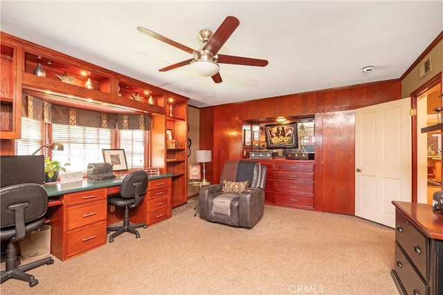 3152 Parkside Dr, San Bernardino, CA 92404 - office area with light carpet, ceiling fan, and wood walls