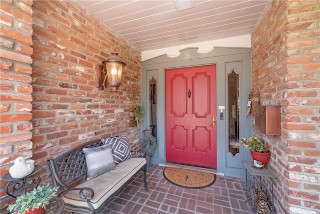 3152 Parkside Dr, San Bernardino, CA 92404 - view of exterior entry featuring brick siding and a porch