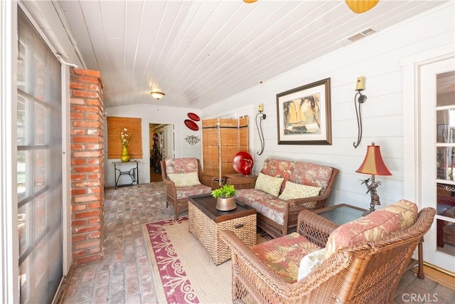 3152 Parkside Dr, San Bernardino, CA 92404 - living area with brick flooring and wooden ceiling