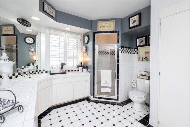 3152 Parkside Dr, San Bernardino, CA 92404 - full bathroom featuring toilet, a stall shower, and double vanity