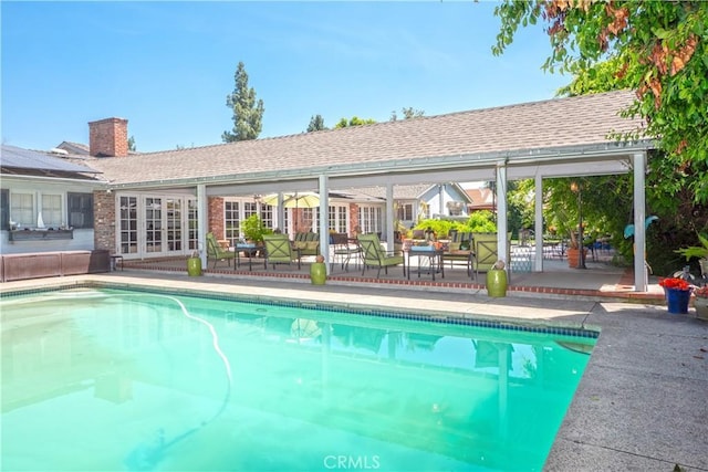 3152 Parkside Dr, San Bernardino, CA 92404 - swimming pool featuring french doors and a patio area