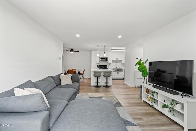 205 W Channel Islands Blvd, Port Hueneme, CA 93041 - living room with light wood-style flooring, recessed lighting, a ceiling fan, and baseboards