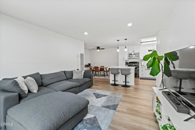 205 W Channel Islands Blvd, Port Hueneme, CA 93041 - living room featuring light wood-style flooring, ceiling fan, and recessed lighting