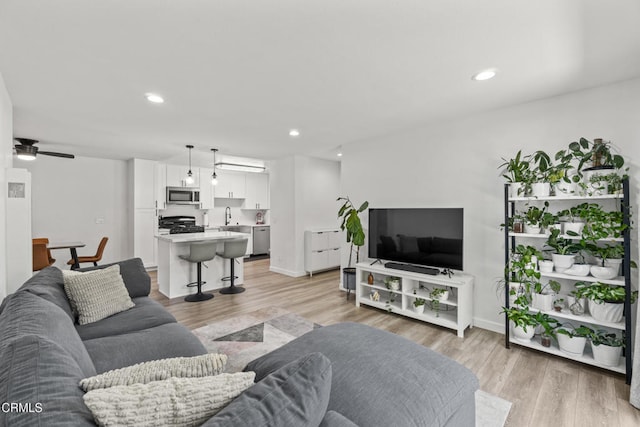 205 W Channel Islands Blvd, Port Hueneme, CA 93041 - living room with light wood finished floors, ceiling fan, recessed lighting, and baseboards