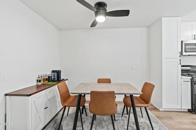 205 W Channel Islands Blvd, Port Hueneme, CA 93041 - dining space with light wood-style flooring and a ceiling fan