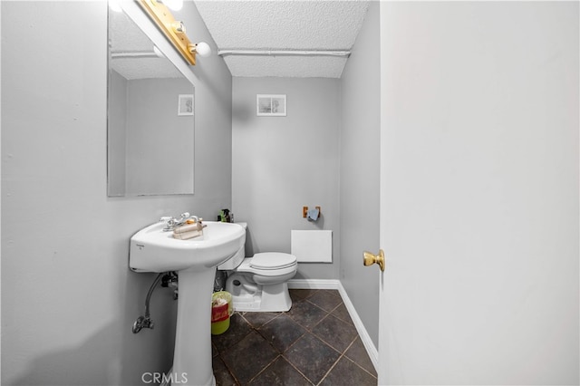 5223 Rosemead Blvd Unit F, San Gabriel, CA 91776 - half bath with toilet, baseboards, and a textured ceiling