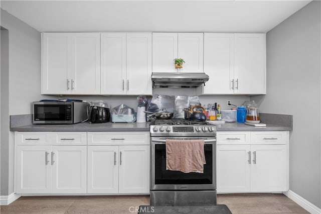 5223 Rosemead Blvd Unit F, San Gabriel, CA 91776 - kitchen featuring appliances with stainless steel finishes, under cabinet range hood, baseboards, and white cabinets