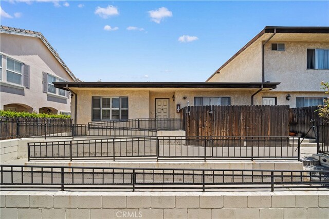 5223 Rosemead Blvd Unit F, San Gabriel, CA 91776 - view of property with stucco siding and a fenced front yard