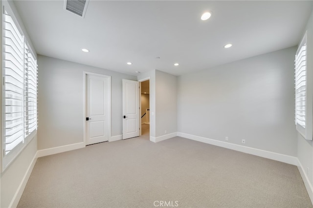 126 Paxton, Irvine, CA 92620 - unfurnished bedroom with light colored carpet, recessed lighting, and multiple windows
