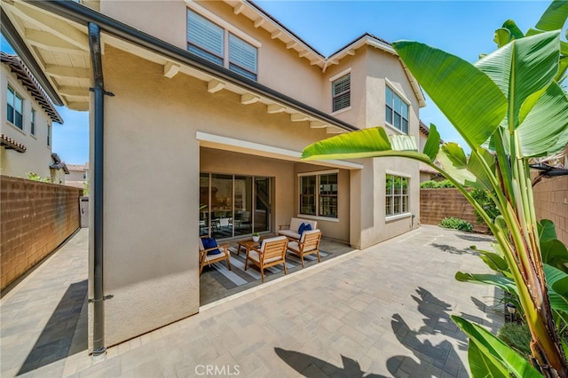 126 Paxton, Irvine, CA 92620 - back of property with stucco siding, a patio, a fenced backyard, and outdoor lounge area