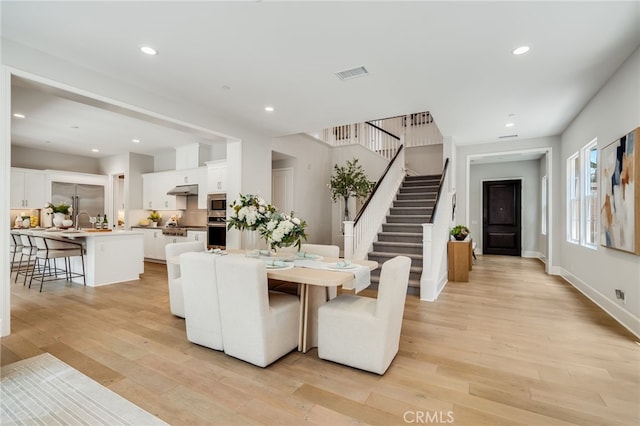 126 Paxton, Irvine, CA 92620 - dining space featuring light wood-style flooring, stairs, and recessed lighting