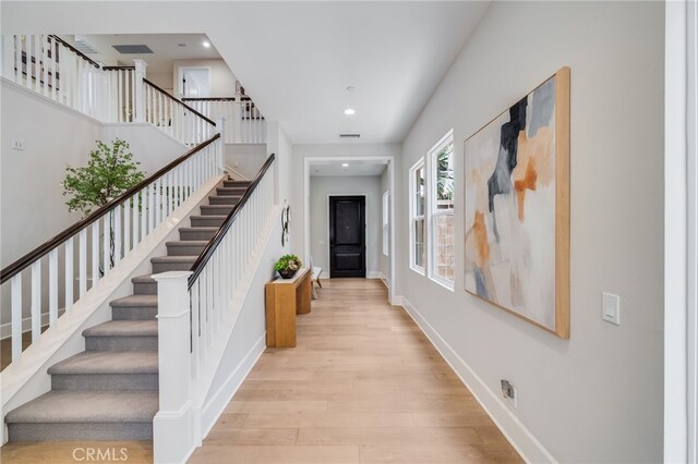 126 Paxton, Irvine, CA 92620 - entrance foyer featuring stairway, wood finished floors, and recessed lighting
