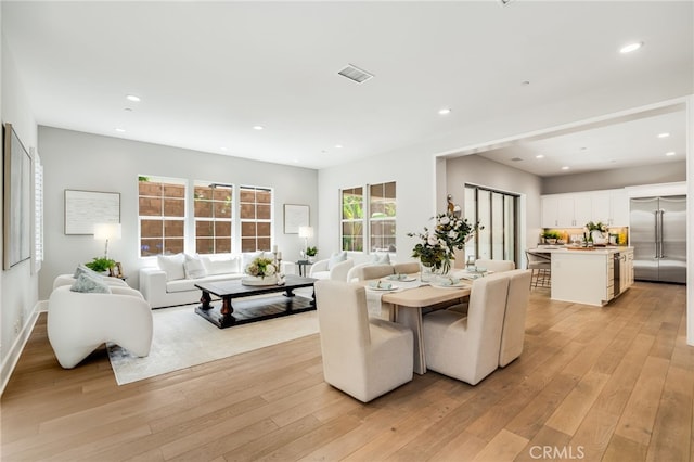 126 Paxton, Irvine, CA 92620 - dining room with light wood finished floors and recessed lighting