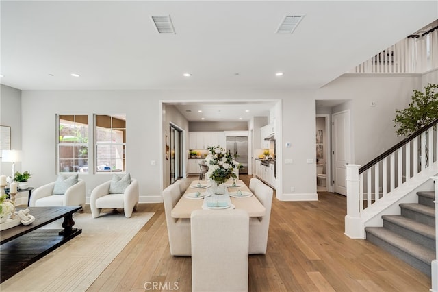 126 Paxton, Irvine, CA 92620 - dining area featuring light wood-style flooring, stairway, and recessed lighting