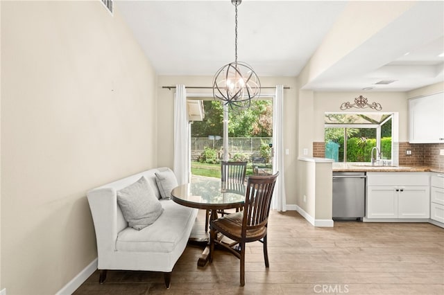 27054 Riversbridge Way, Valencia, CA 91354 - dining room featuring a chandelier and light wood-style flooring