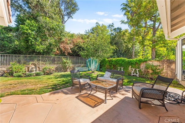 27054 Riversbridge Way, Valencia, CA 91354 - fenced backyard featuring a patio area and an outdoor living space