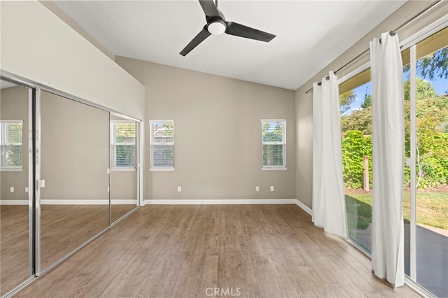 27054 Riversbridge Way, Valencia, CA 91354 - unfurnished bedroom with lofted ceiling, access to exterior, wood finished floors, and multiple windows