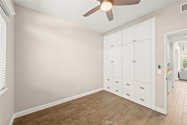27054 Riversbridge Way, Valencia, CA 91354 - unfurnished bedroom with light wood-style floors, a closet, and a ceiling fan