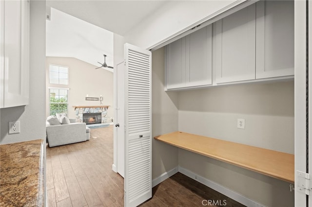 27054 Riversbridge Way, Valencia, CA 91354 - unfurnished office featuring ceiling fan, dark wood-type flooring, a fireplace, and lofted ceiling