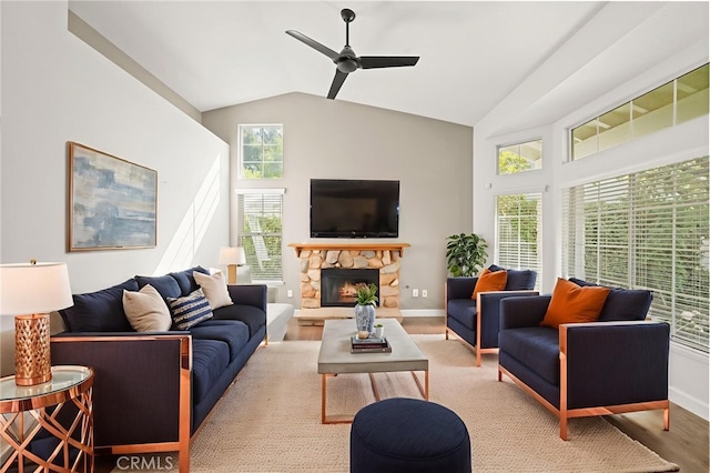 27054 Riversbridge Way, Valencia, CA 91354 - living area featuring ceiling fan, wood finished floors, a stone fireplace, and lofted ceiling