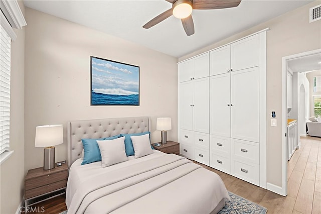 27054 Riversbridge Way, Valencia, CA 91354 - bedroom with light wood-style floors, a closet, and ceiling fan