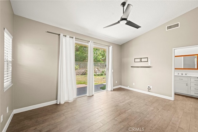 27054 Riversbridge Way, Valencia, CA 91354 - unfurnished room featuring vaulted ceiling, a ceiling fan, and light wood-type flooring