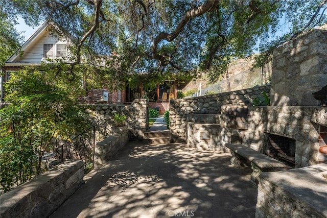 166 Opal Canyon Rd, Duarte, CA 91010 - view of patio / terrace featuring an outdoor stone fireplace
