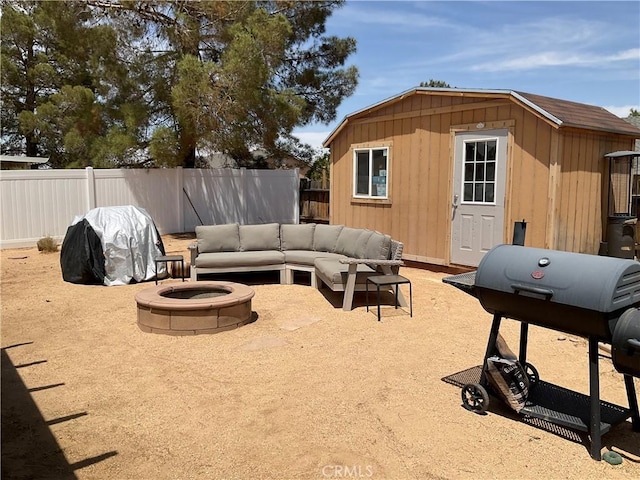 17911 Juniper St, Adelanto, CA 92301 - view of patio with grilling area, an outdoor structure, and an outdoor living space with a fire pit