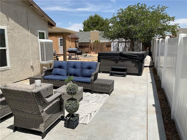17911 Juniper St, Adelanto, CA 92301 - fenced backyard with a hot tub, a patio area, an outdoor hangout area, and area for grilling