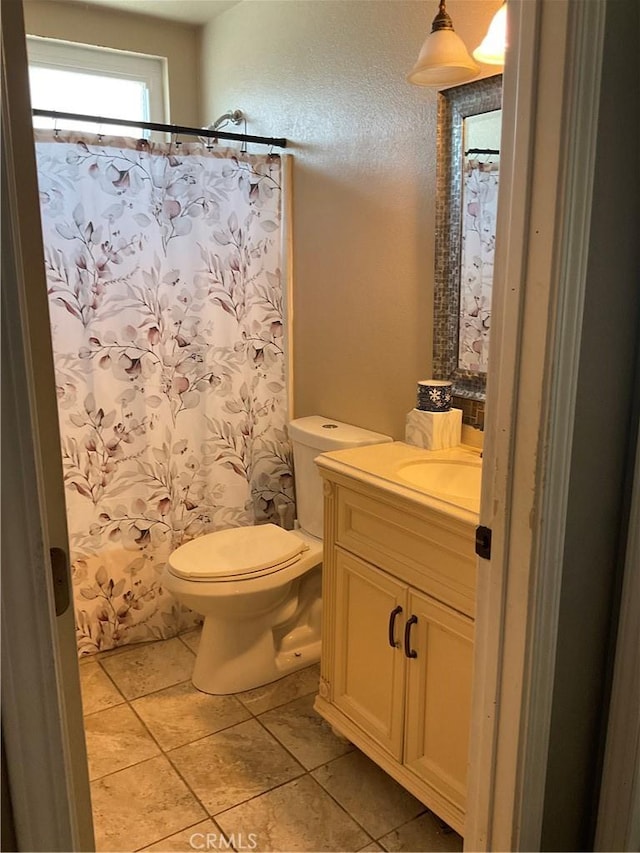 17911 Juniper St, Adelanto, CA 92301 - bathroom featuring vanity, tile patterned flooring, toilet, and a shower with curtain