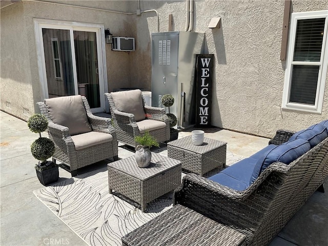 17911 Juniper St, Adelanto, CA 92301 - view of patio with an outdoor living space and a wall mounted AC