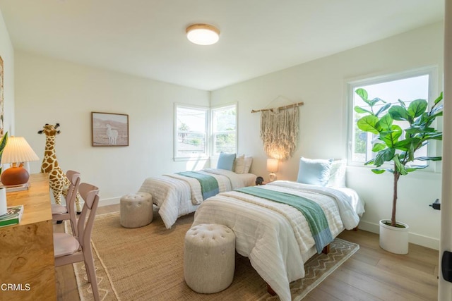 1906 S Meridian Ave, Alhambra, CA 91803 - bedroom featuring multiple windows, light wood finished floors, and baseboards