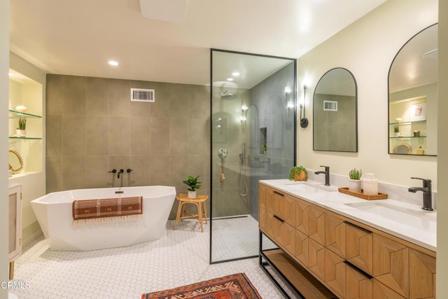 1906 S Meridian Ave, Alhambra, CA 91803 - bathroom with a walk in shower, a freestanding bath, double vanity, tile patterned flooring, and recessed lighting