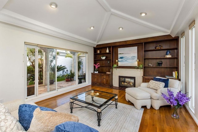 4400 Chaumont Rd, Woodland Hills, CA 91364 - living room featuring wood finished floors, a fireplace with flush hearth, recessed lighting, and built in features