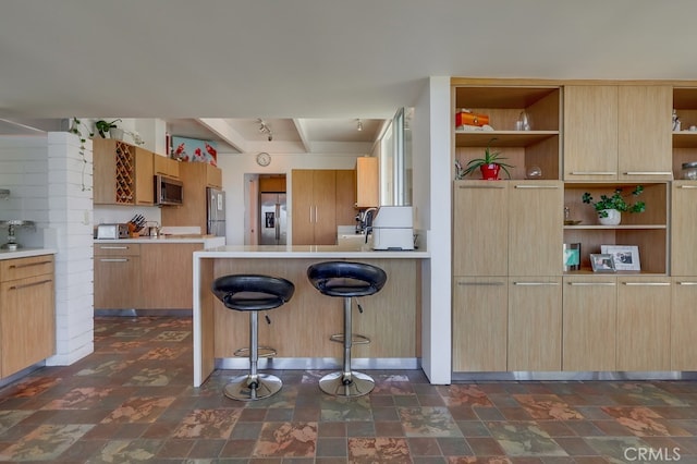 27649 Palos Verdes Dr E, Rancho Palos Verdes, CA 90275 - kitchen featuring stainless steel appliances, open shelves, a breakfast bar, a peninsula, and beamed ceiling